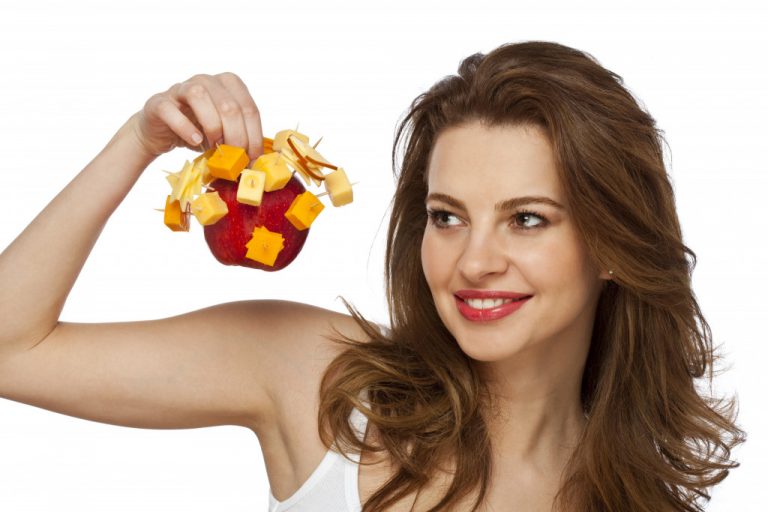 woman eating fruit and cheese