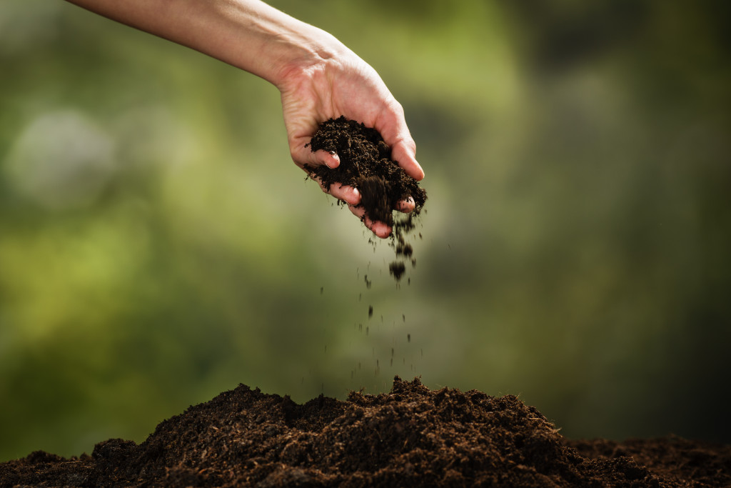 hand scooping soil