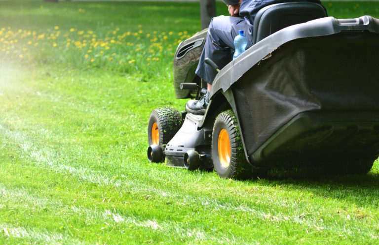 a man lawn mowing