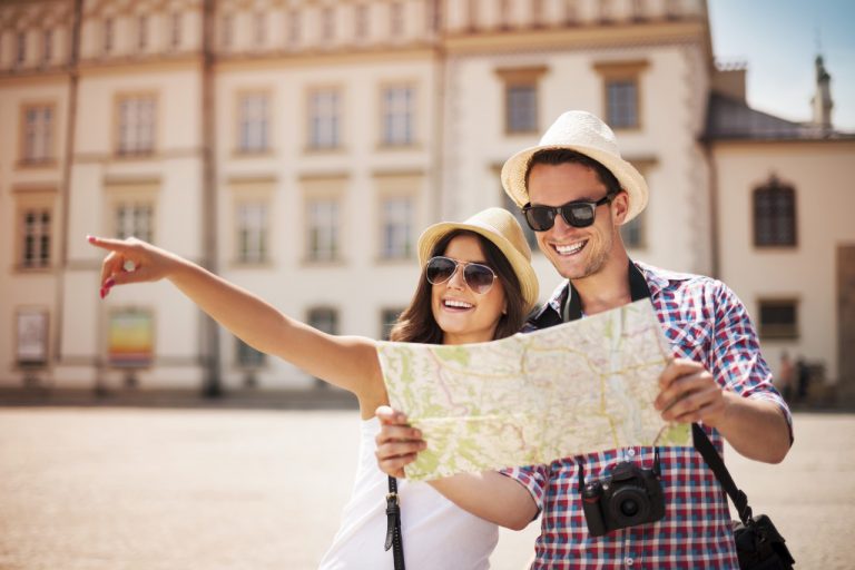 couple of tourist looking at the map