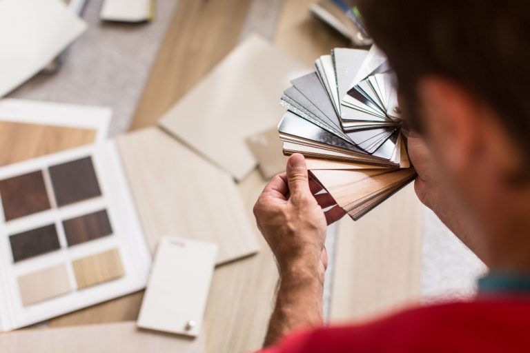 Man chosing the right flooring for his house/apartment