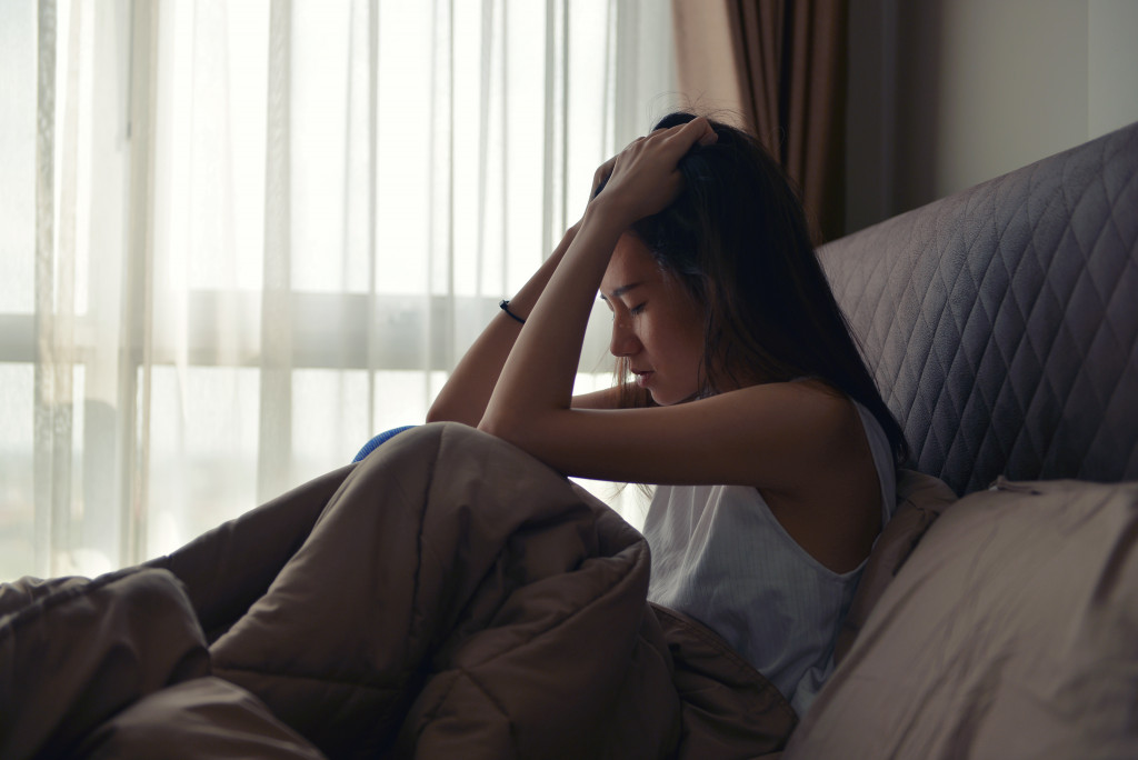 woman anxious while in bed