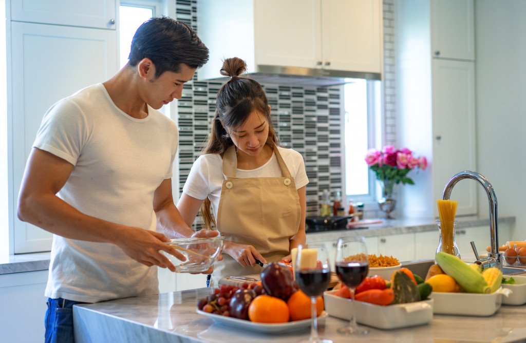 couple preparing meal in their kitchen