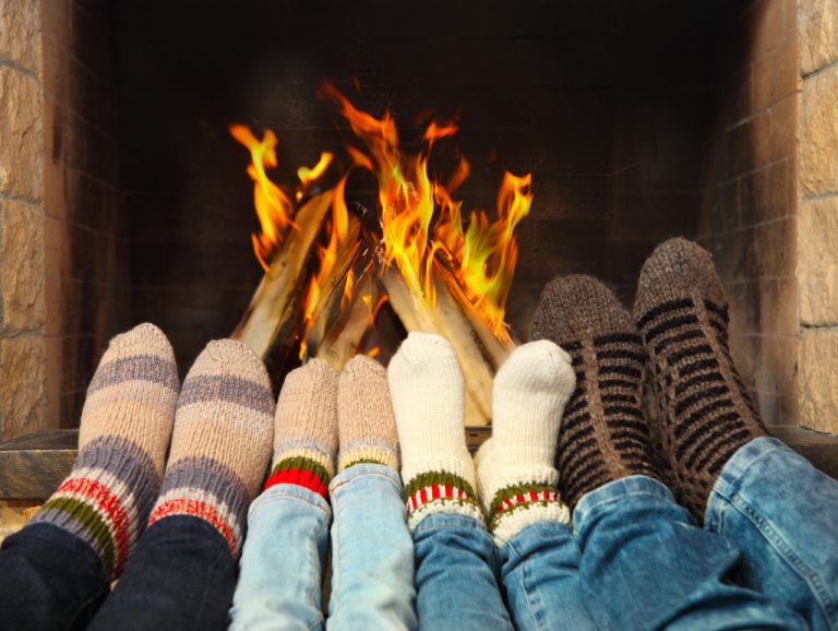 feet in front of a fireplace