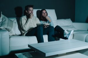 couple watching a movie at home