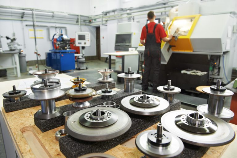 industrial cutting tools in front of cnc milling machine center in tool workshop manufacturing