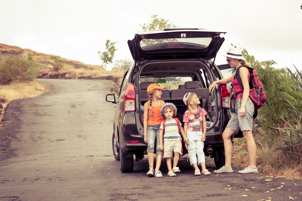 family behind a car