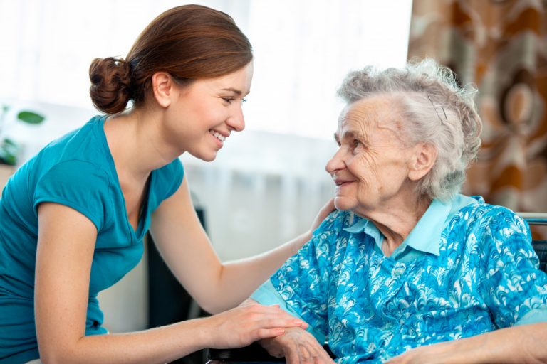 woman taking care of an elderly