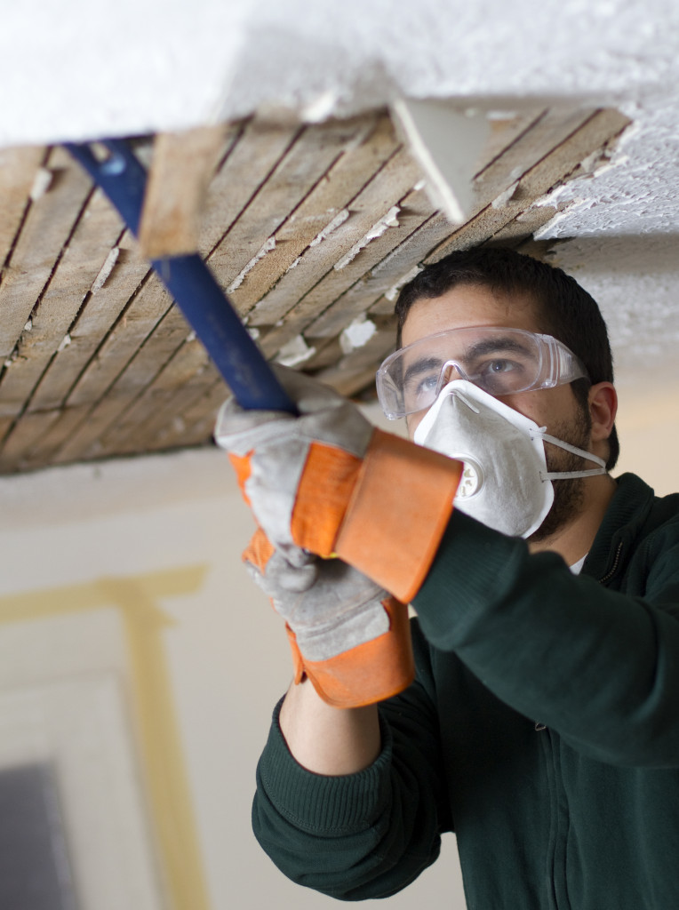 contractor dismantling the roof