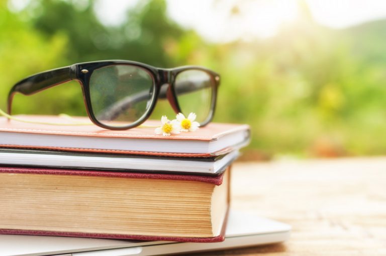 glasses on top of book