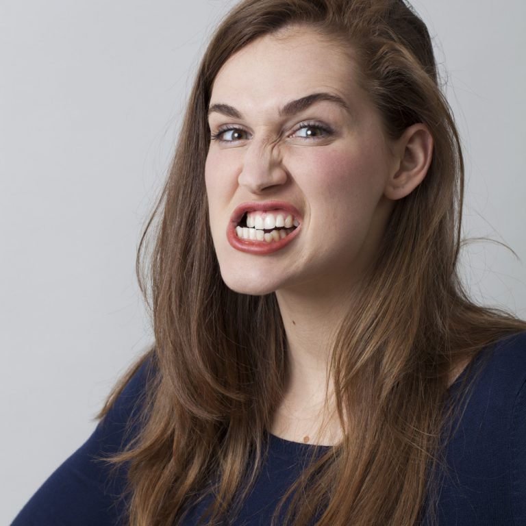 Woman grinding her teeth aggressively