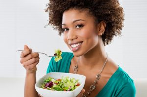 a person eating salad