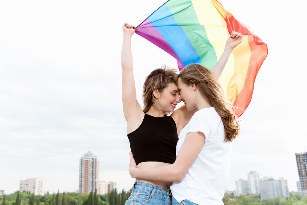 Same sex couple hugging and posing for the photo