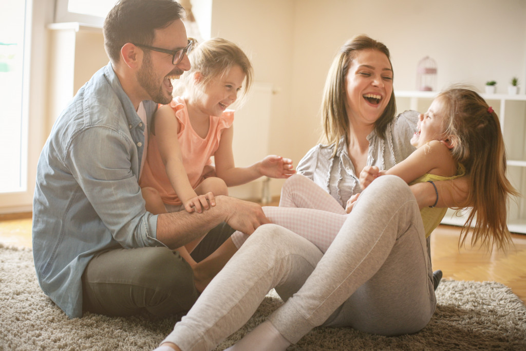 mom and dad playing with their kids