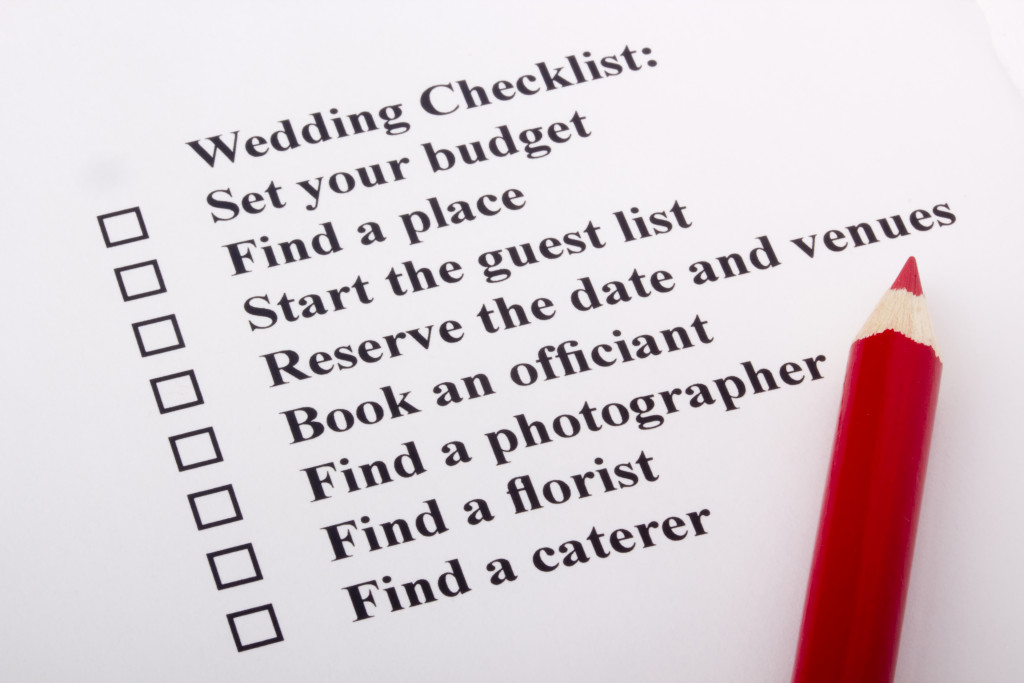 wedding checklist with red pencil on printed paper