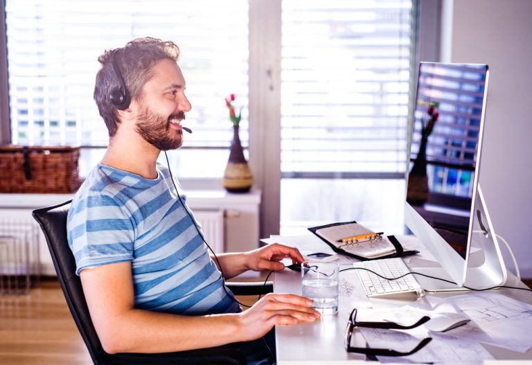 a man on a workspace setup at home