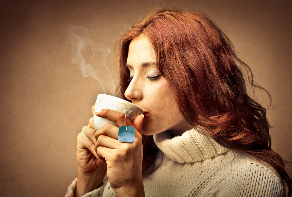 beautiful woman drinking a cup of tea