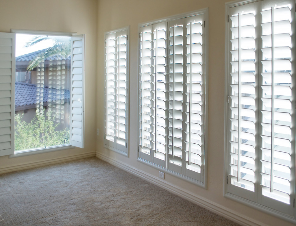 An image of windows with shutters