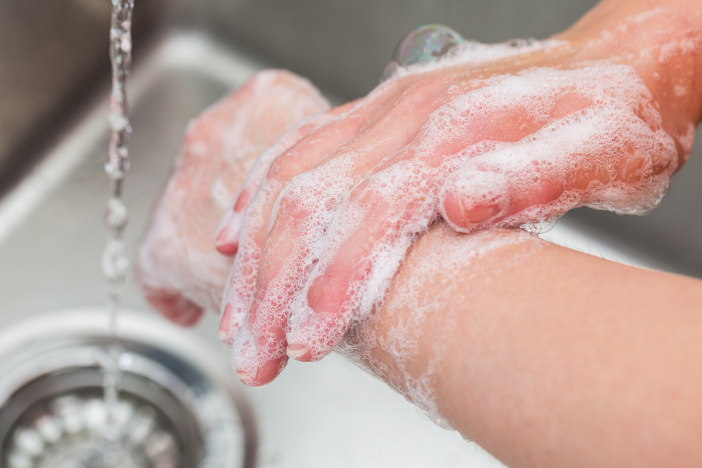 Handwashing with soap with running water