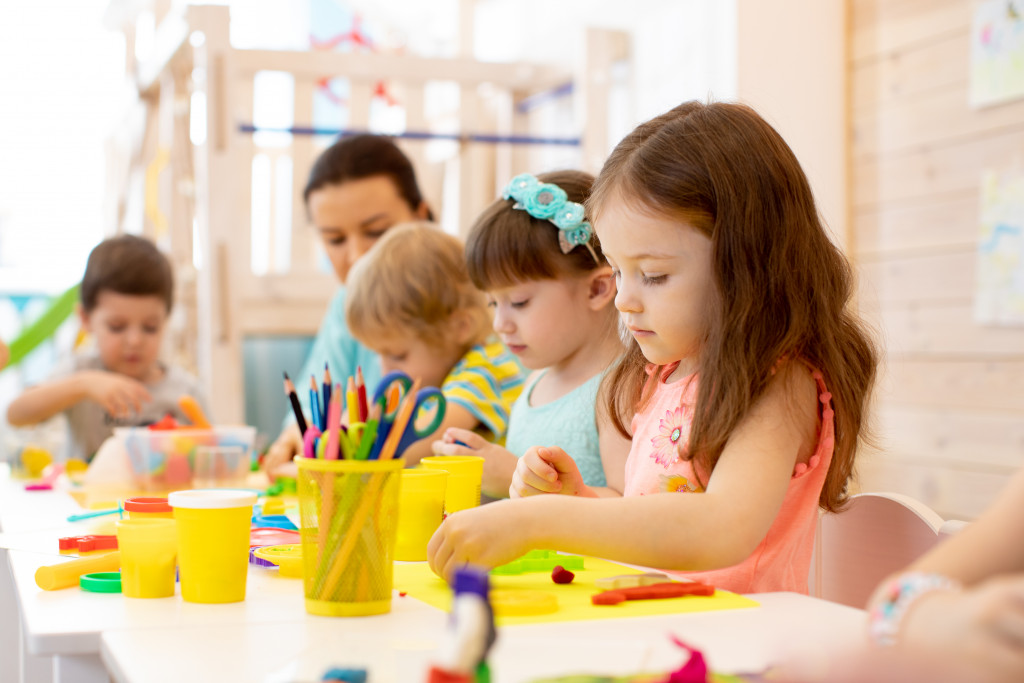 Kids making artworks using clay