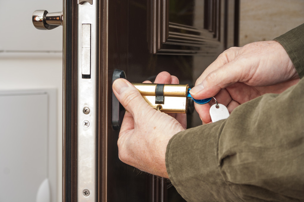 A man changing the door lock