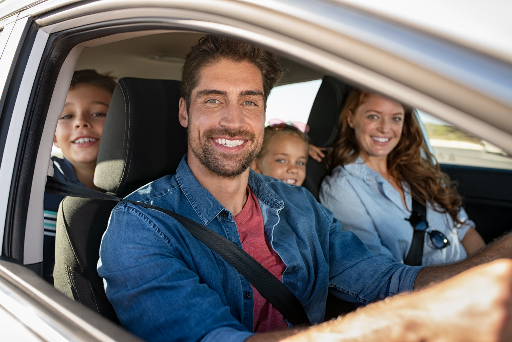 a family in a car going on a road trip