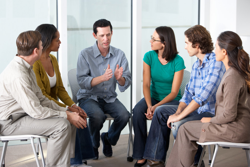 man talking in support group or therapy