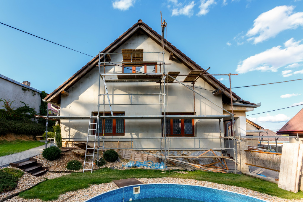 fixer upper with various construction facade indicating renovation and repairs