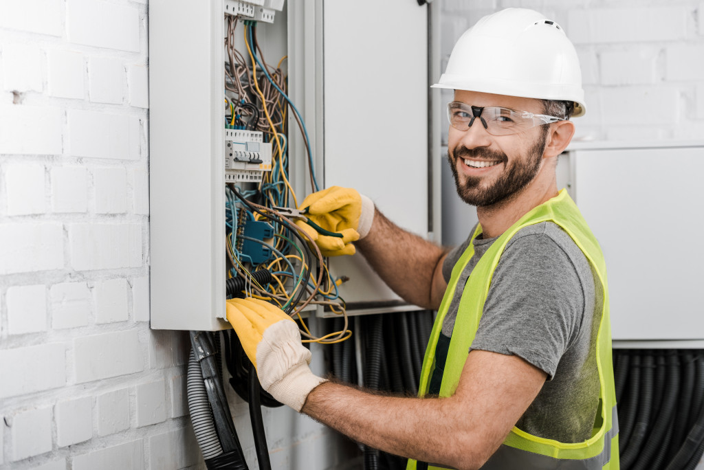 An electrician working on home repairs