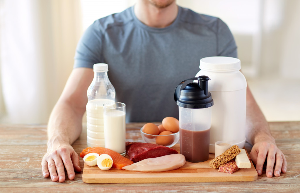 man with food on the table