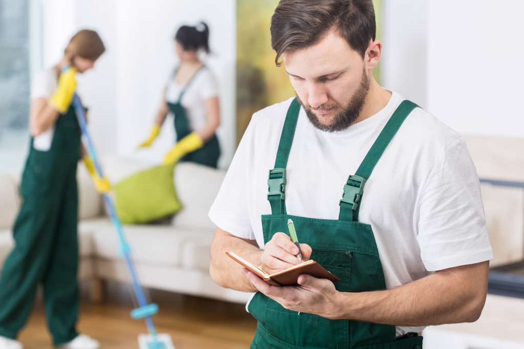 Professional contractors cleaning home