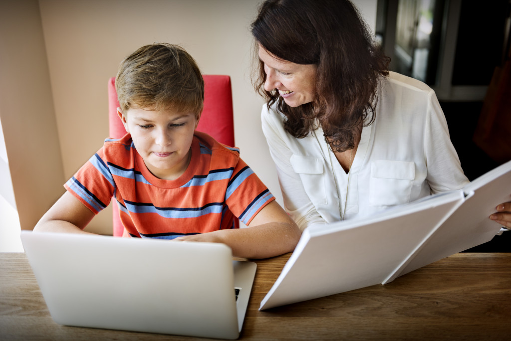 mom helping child with homework