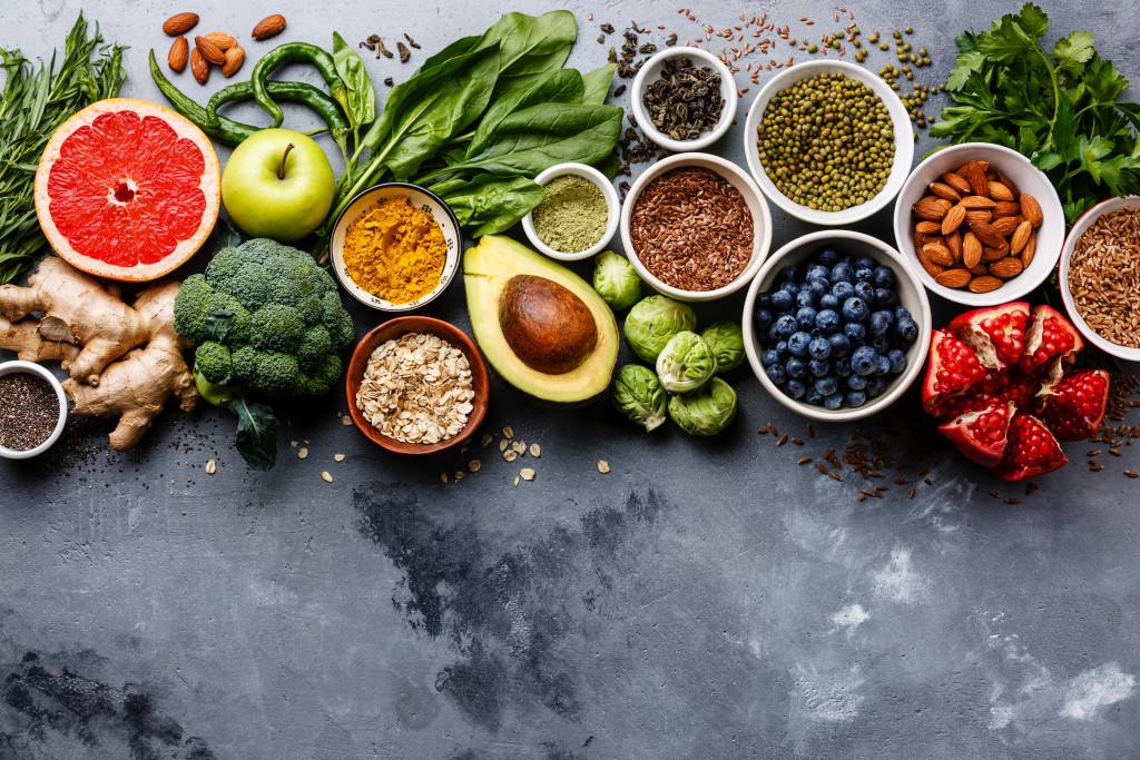 Various fruits and vegetables on a gray table