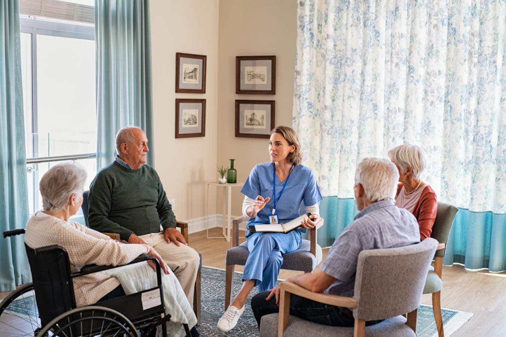 senior support group with medical professional in the middle