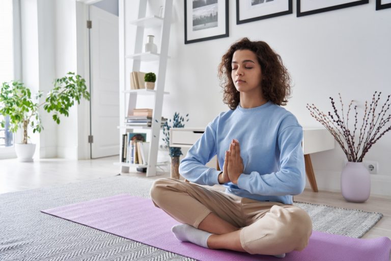 woman practicing mindful living at home