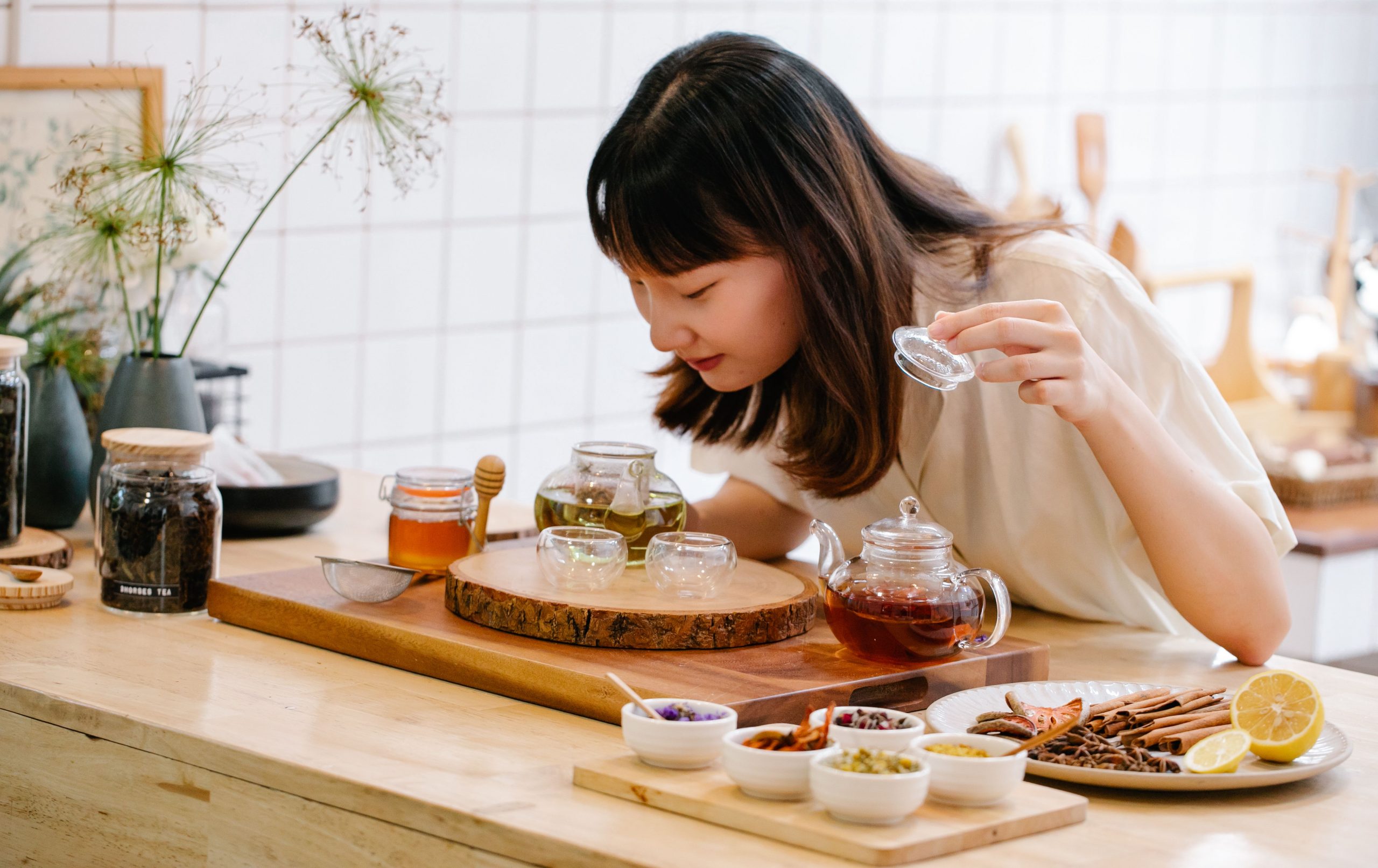 woman preparing herbal tea